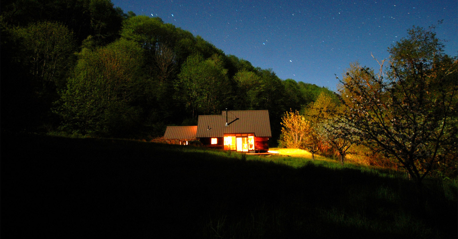 shotpouch cabin at night