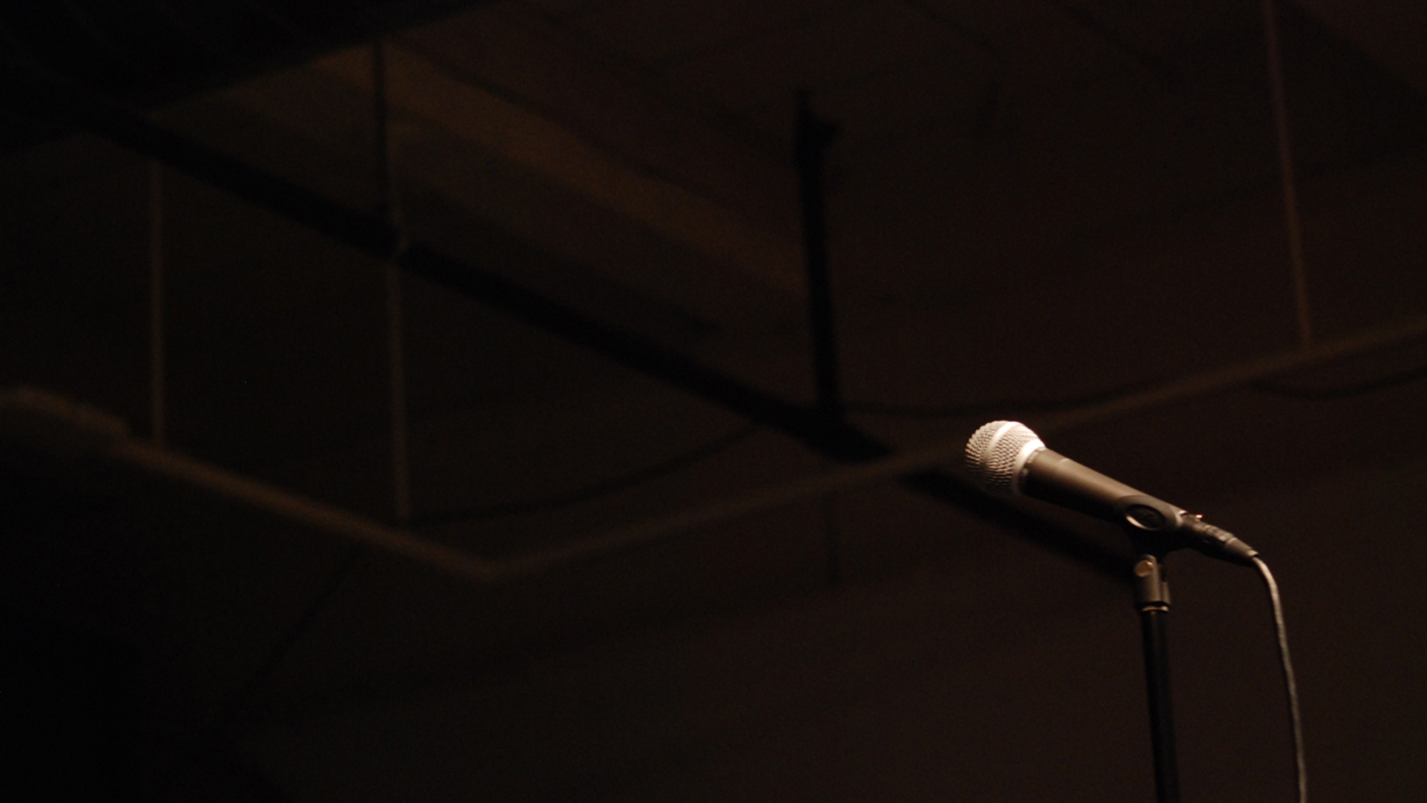 microphone on a dark stage