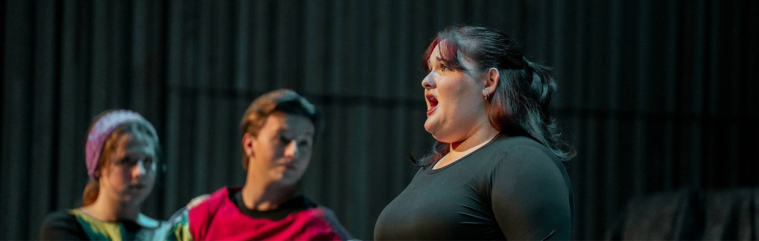 A student singing as part of a lyric workshop