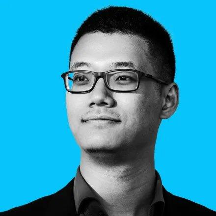 Shawn Shan headshot with turquoise background 